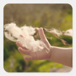 A Child Holding A Piece Of Wool Square Sticker