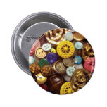 A Collage of Buttons including Yellow Wheel Button