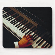 A man playing piano mouse pads
