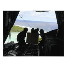 Airmen push out a pallet of donated goods 2 photograph