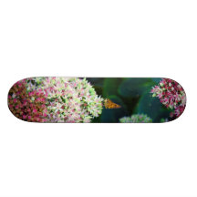 Artistic Rendition of Butterfly Perched on Flowers Skateboards