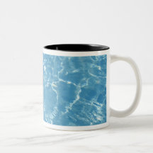 Beach ball in swimming pool coffee mugs