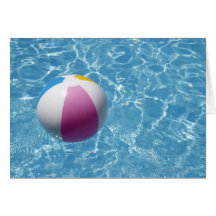Beach ball in swimming pool greeting card