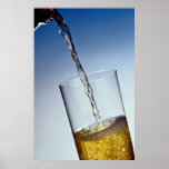 Beer poured into glass poster