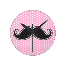 Black handlebar moustache on girly pink polka dots