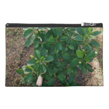 Blossoming hibiscus plant with pink flowers travel accessories bag