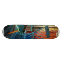Blue Chair Against Red Door Skateboard Deck