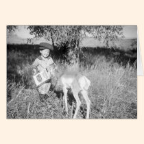 Boy feeding antelope by hand cards
