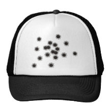 Bullet holes from a rifle or gun, possibly shotgun hats