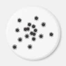 Bullet holes from a rifle or gun, possibly shotgun fridge magnets