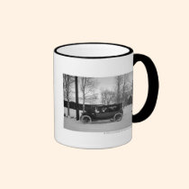Car with Christmas tree tied on the hood mugs