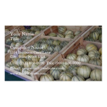 Charentais melons displayed in grocery store business card