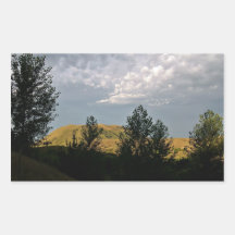 Clouds over mountains in summer evening sticker
