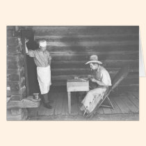 Cook watching a cowboy play cards 2 cards