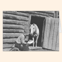 Cowboy reading a letter with a horse cards