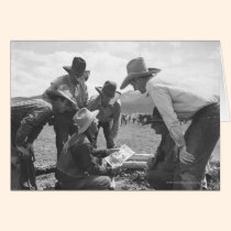 Cowboys looking a magazine cards