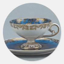 Cup and saucer with colourful designs stickers