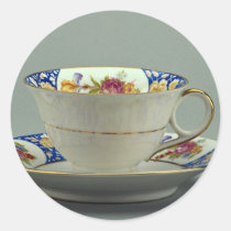 Cup and saucer with colourful flower designs on it stickers