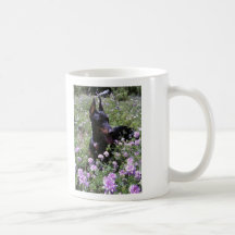 Doberman resting in Wild Flower Bed Mug
