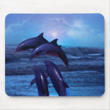 Dolphins playing in the ocean mouse pads