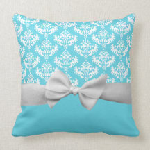 Fake white ribbon bow on blue pillow