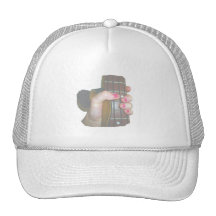female hand holding four string bass neck faded mesh hat
