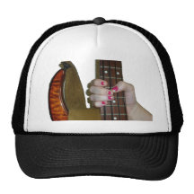 female hand holding four string bass neck trucker hats
