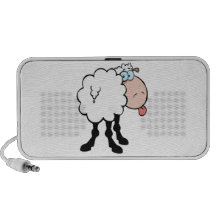 funny cute sheep sticking tongue out from behind notebook speakers
