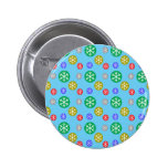 Gold silver red green snowflakes on blue buttons