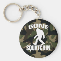 Gone Squatchin white logo with Camo Background Keychains