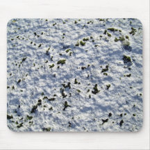 Green Moss Growing Over Snowy rock Surface Mousepads