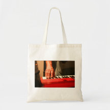 hand playing red keyboard male musician bags