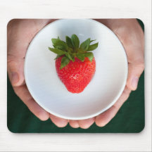 Hands holding a plate with strawberry mousepad