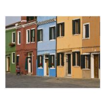 Italy, Burano. Colourful row of homes and empty Postcard
