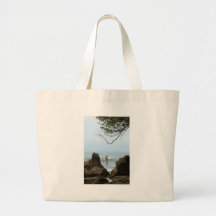 Lone surfer tranquillity surfing canvas bags