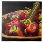 Mixed colours and types of peppers tile