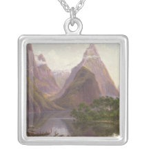 Native figures in a canoe at Milford Sound Pendants
