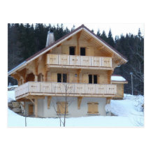 New chalet in the snow postcard