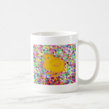 Newborn yellow chicken on colourful background mug