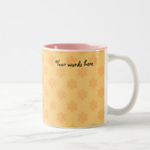 Orange snowflakes on orange background coffee mug