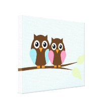 Owl couple on a branch canvas prints