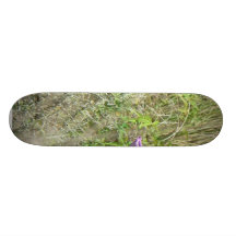 Pink Flowers In The Grass Skateboards