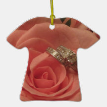 Pink rose with wedding rings ornaments