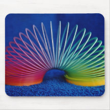Rainbow-coloured slinky toy mouse mat