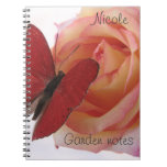 red butterfly on pink rose notebook