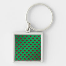 Red shamrocks on green background keychains