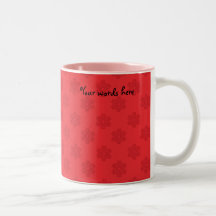 Red snowflake pattern on red coffee mugs