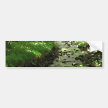 River flowing through woodland. bumper stickers