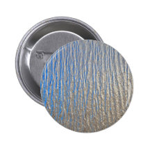 Shiny surface texture with grey and blue pinback button