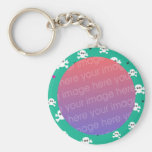 skull and crossbones on teal keychain